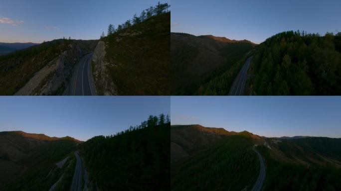 鸟瞰图空蛇形柏油路公路上的山顶黑暗悬崖石纹理