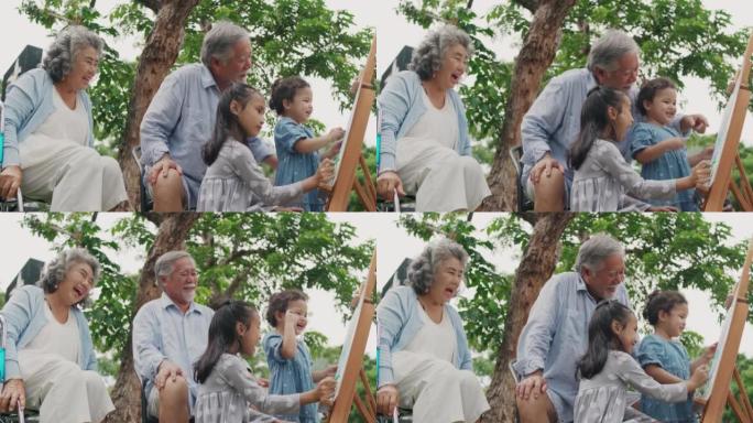 快乐的亚洲家庭: 祖父母和孙女在公园里玩得开心