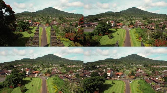 印度教门户入口的空中拍摄，无人机飞向山丘。印度尼西亚巴厘岛。风景如画的风景和道路。