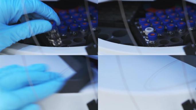 橡胶手套科学家将HPLC小瓶放入自动样品中进行测量