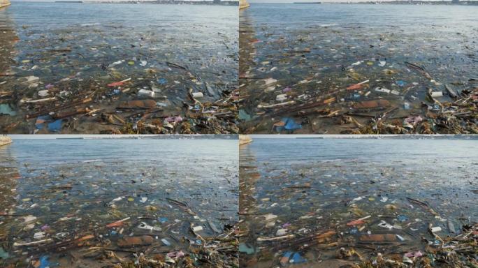 海水里有很多垃圾。水面上的塑料碎片。海洋污染，环境灾难