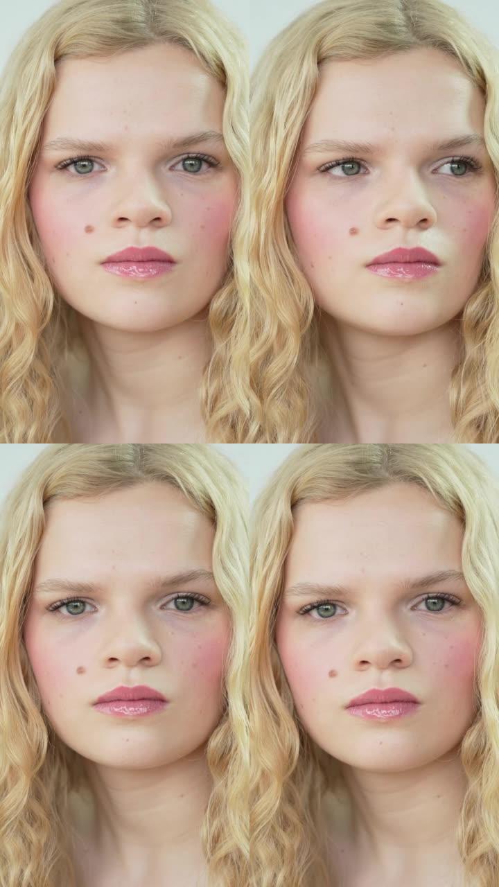 作为前卫复古化妆故事的一部分，一个年轻女子的脸特写
