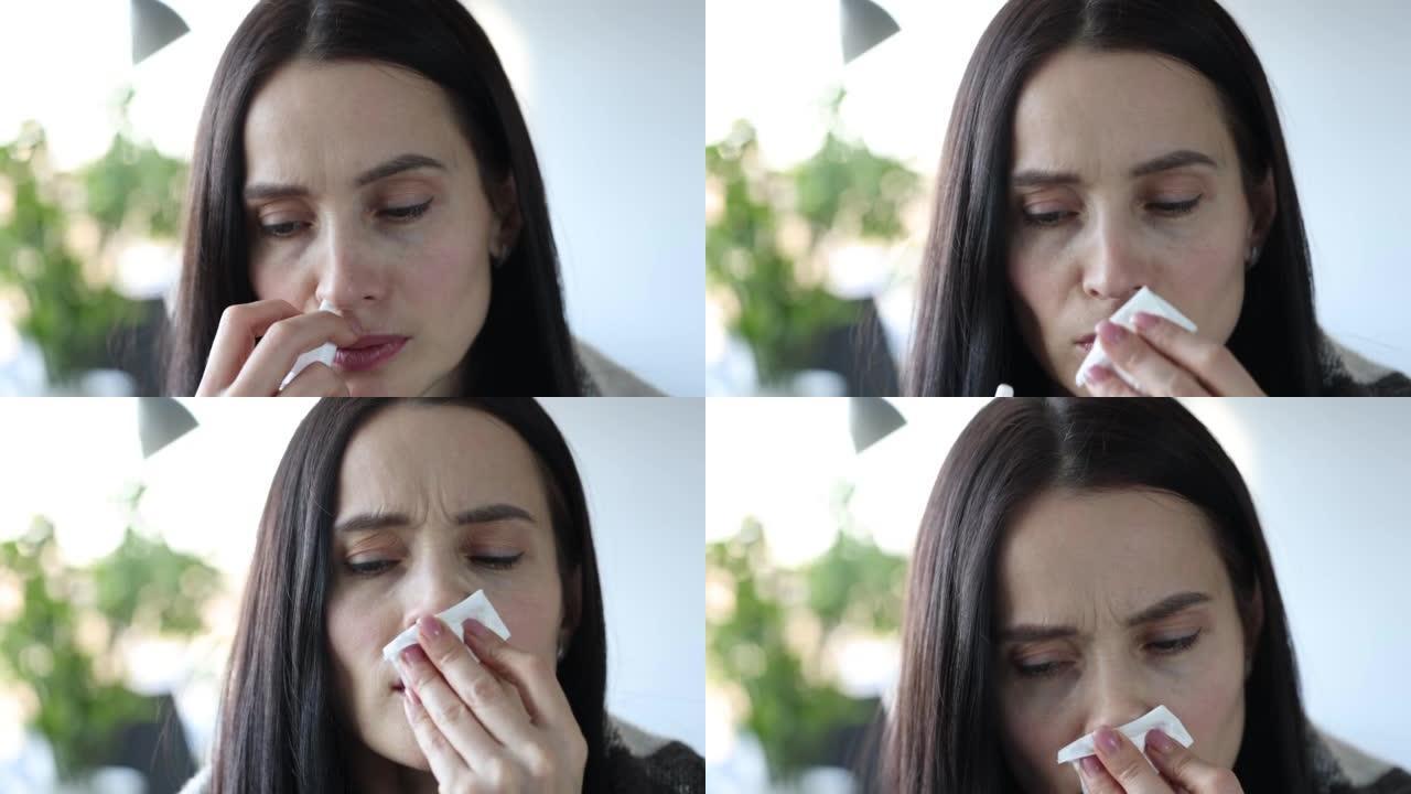 严重流鼻涕的女人手拿药喷入鼻子