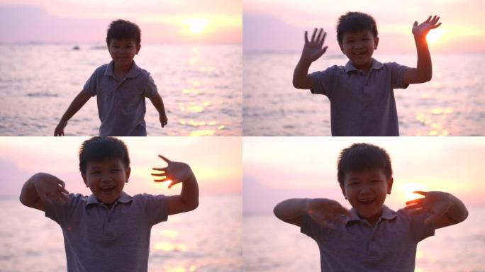 亚洲男孩举起手臂，在海滩上打招呼或再见。放松和幸福的概念