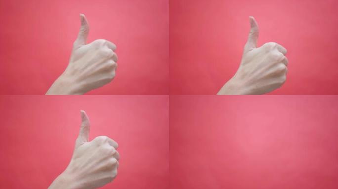 女人在孤立的红色4k背景上竖起大拇指。手势，工作室。广告。批准。好心情，支持，国际签