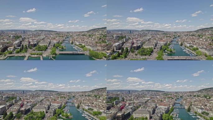 在一个晴朗多云的春日，鸟瞰Zürich城和Zürich湖，以及中世纪古城Zürich和利马特河的天际