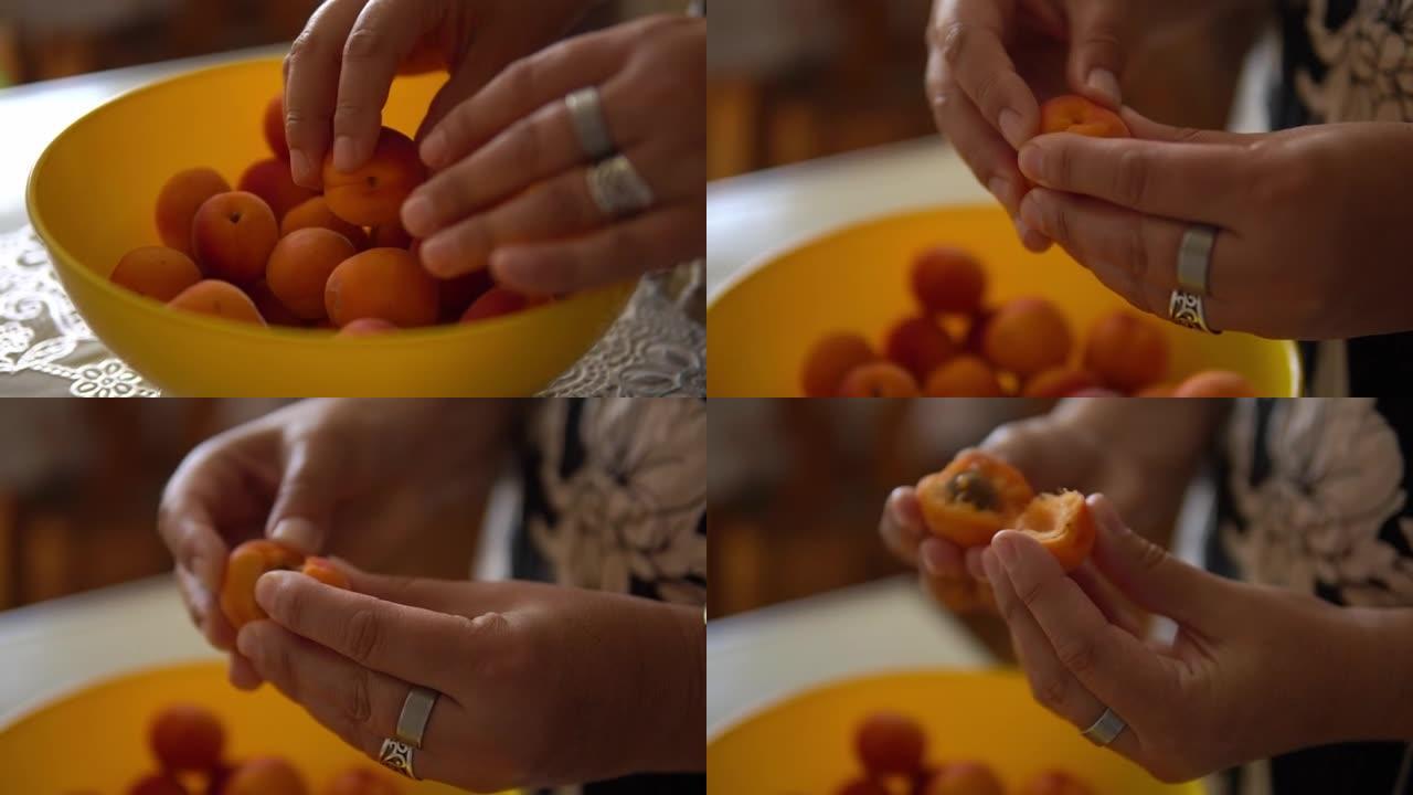 杏视频。用手劈开杏子。