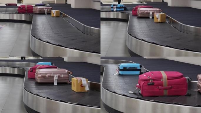 在机场行李认领区的旋转木马上移动的旅行袋热