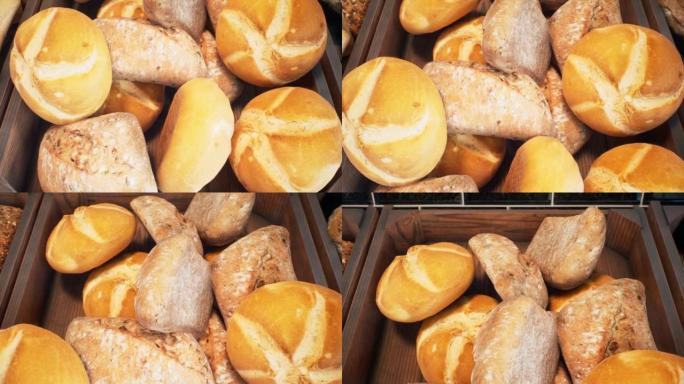酥脆美味的开胃面包和新鲜出炉的面包。丰满的面包和糕点的特写。新鲜面包概念。动画非常适合关于美味食物和