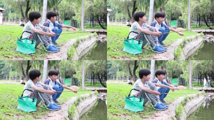 小男孩在湖边钓鱼小男孩在湖边钓鱼