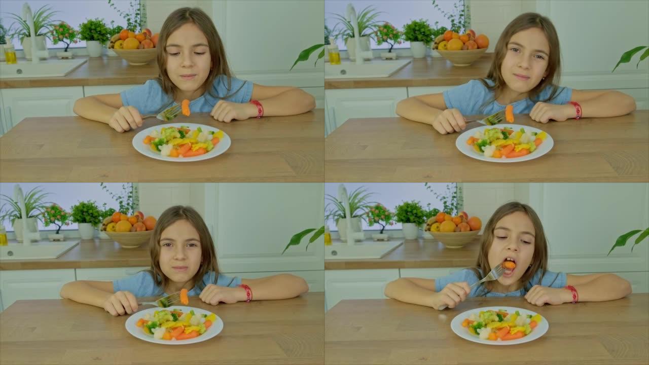 这孩子吃煮菜。选择性聚焦。食品。