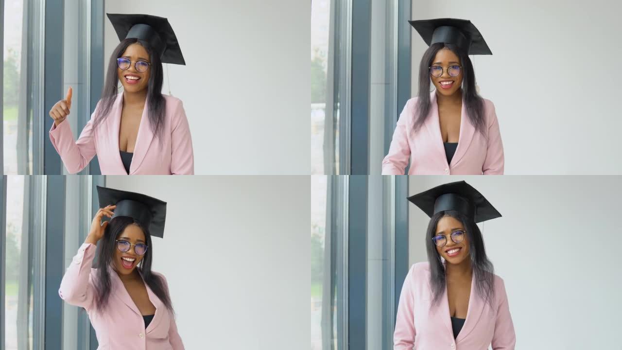一位穿着浅粉色经典西装和方形大师帽子的非裔美国女毕业生摆姿势，欢快地跳舞。。国外妇女高等教育