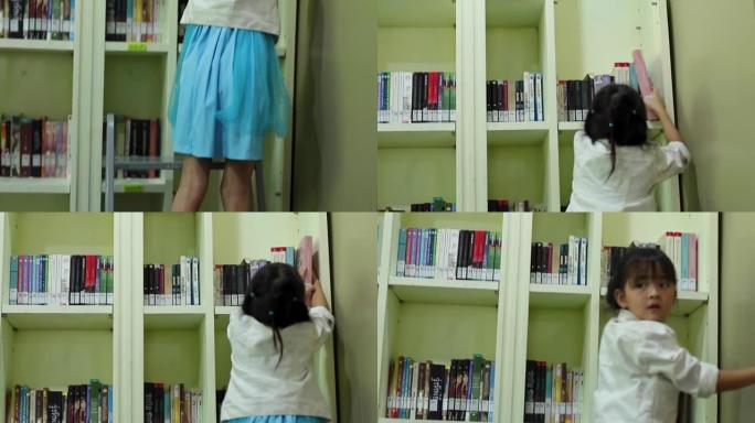 小女孩在书架上找书。