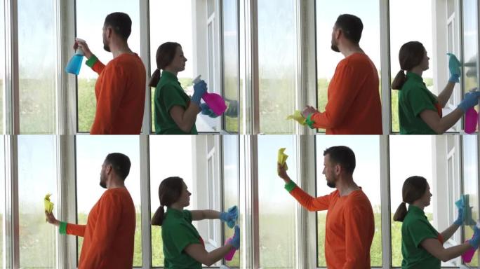穿着工作服的清洁公司工人正在城市公寓中喷洒清洁剂并擦拭窗玻璃。用喷雾瓶清洗窗户。