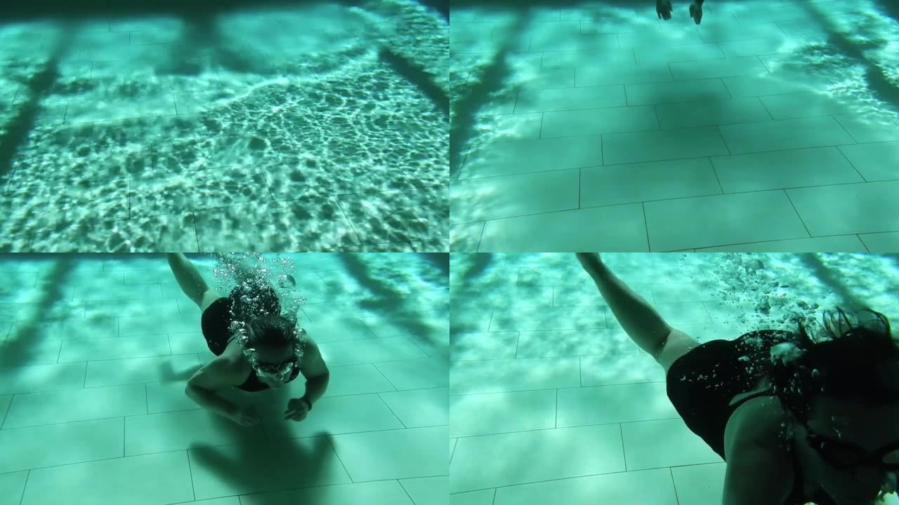 戴护目镜的女人在游泳池里水下游泳，有波浪和阴影