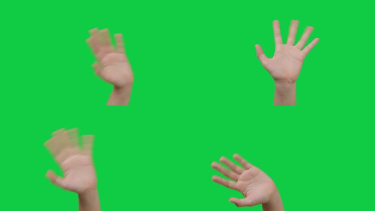 肢体语言，女人的手在绿色上挥舞着打招呼或再见