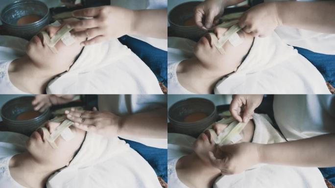 接受按摩和水疗治疗的年轻女子