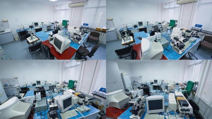 现代医院分析医学实验室。设备齐全的测试和研究空间。实验室中的显微镜、计算机和其他仪器。
