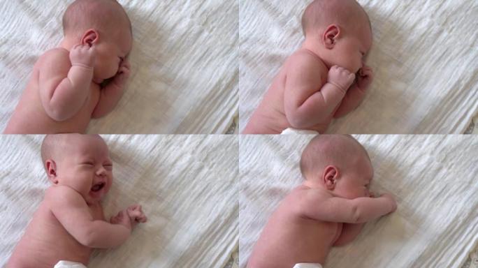睡在毯子上的可爱新生婴儿