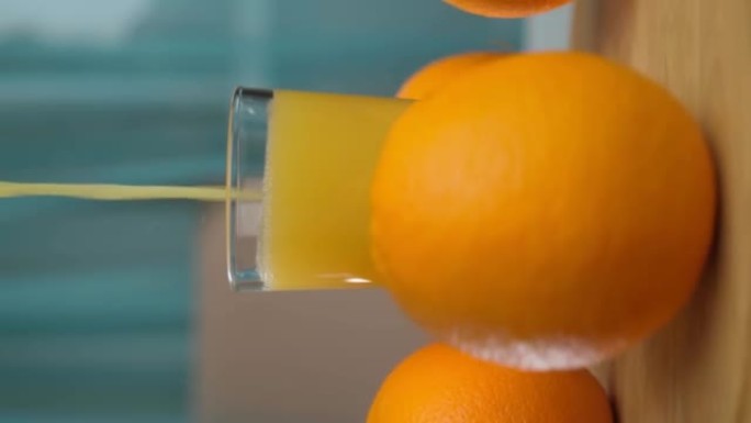 新鲜排毒橙汁可增强维生素c。健康的生活方式理念。选择性聚焦。垂直视频