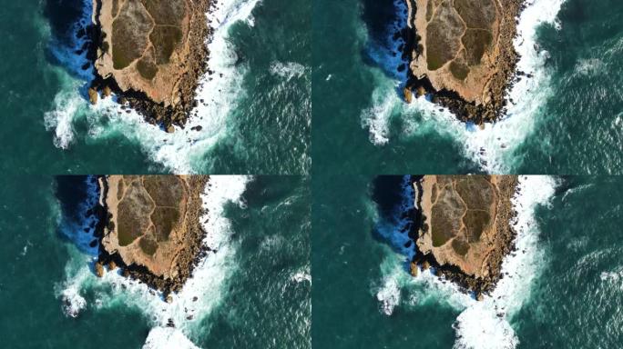 大西洋撞击海岸花岗岩岩石的区域视图。西班牙加那利岛海洋色彩惊人的岩石环境