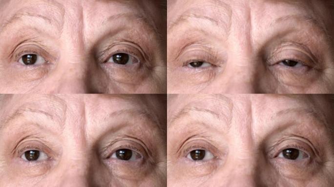 一位老妇人的脸特写。成熟女人的眼睛。慢动作