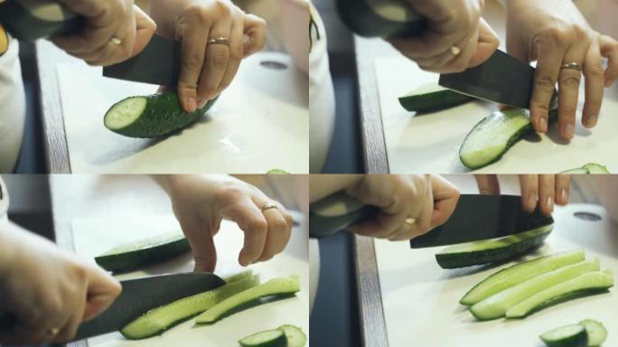 一个女人把黄瓜切成条。