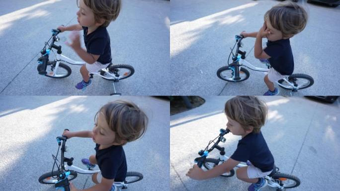 小男孩从上方角度在外面骑自行车