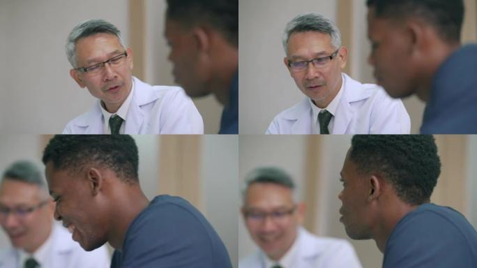 非裔亚裔男子密切关注医生向他解释药物。