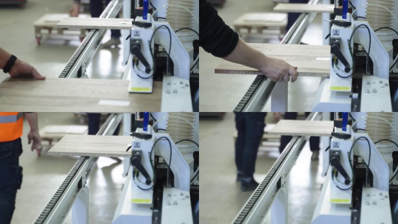 木制中密度纤维板部件沿着配备特殊的输送机移动。