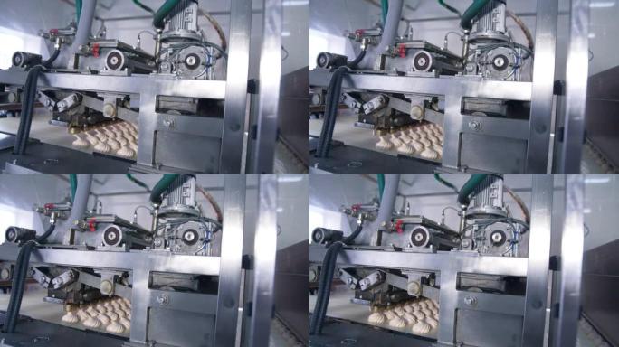 生产棉花糖甜点的复杂机制。制造糖果的自动化生产线。