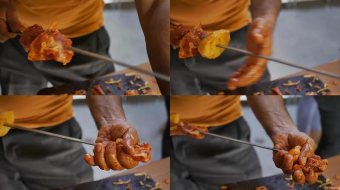 Dop，慢动作: 烹饪埃里温·霍洛瓦茨特写的过程。男人的有力手刺穿并将肉和土豆粘在尖锐的串烧上。亚美