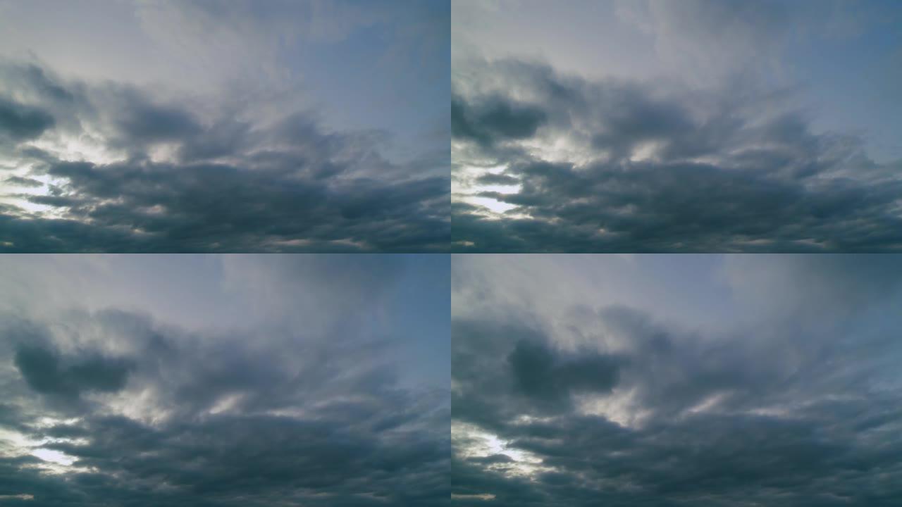 蓝天下的云和阳光。太阳光线令人叹为观止的云层。时间流逝。