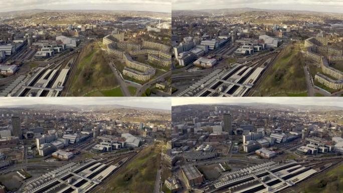 谢菲尔德电车和火车站的4k航拍画面，城市景观天际线