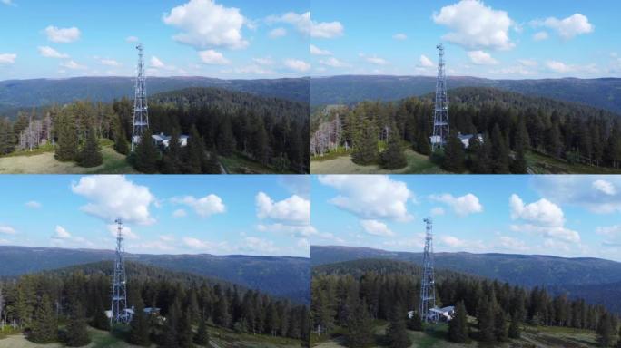 法国塞里沙普孚日4K山区森林中的高电信天线桅杆塔周围的空中轨道视图