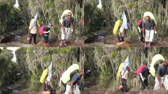 在乞力马扎罗山攀登期间，徒步旅行者带着向导登上希拉营地