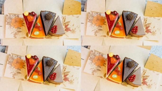 在打开的盒子里放几片白色和红色的草莓，樱桃蛋糕和巧克力。微距和滑块拍摄。背景是复古的气氛