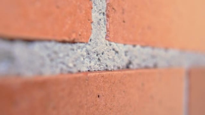 红砖墙配水泥接缝特写。宏