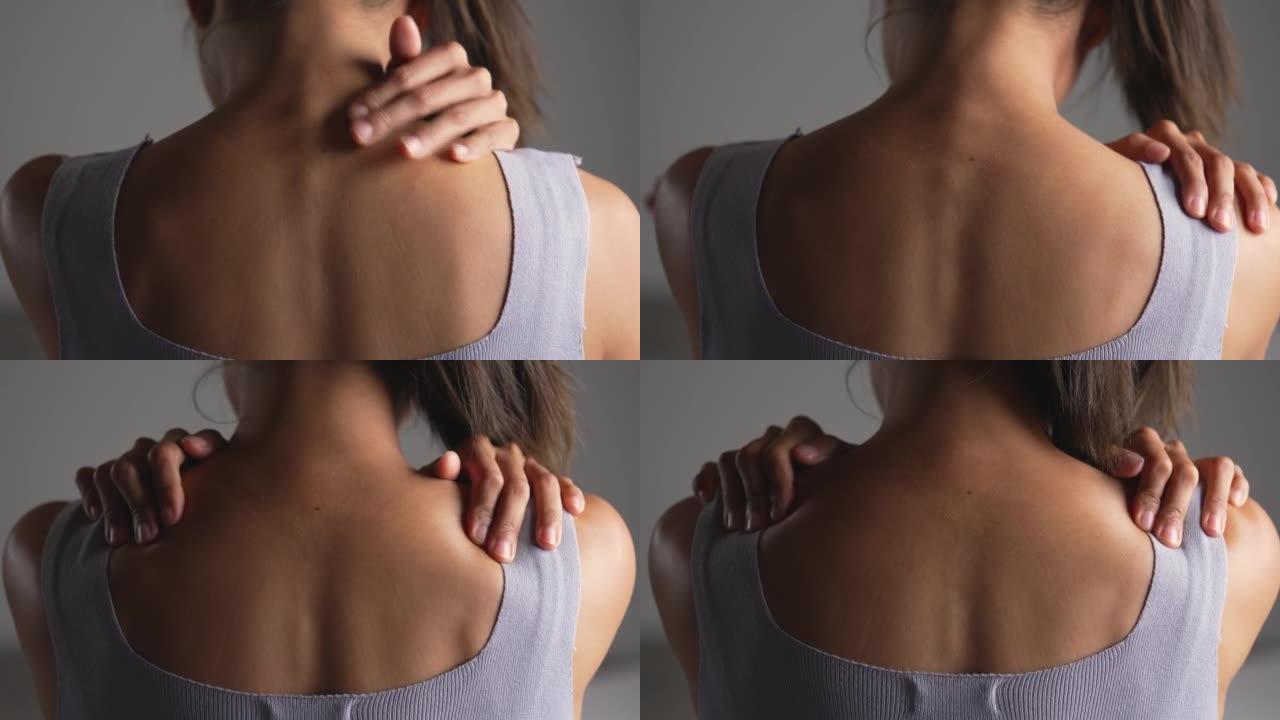 亚洲女人肩膀疼痛。女性用另一只手握住痛苦的肩膀。身体肌肉有问题、医疗保健和医学的人。