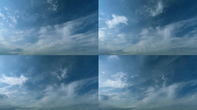 在蓝天上飞舞移动的白云。蓝天背景，有许多层微小的云。延时。
