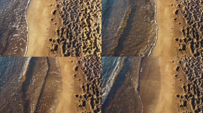无人机鸟瞰图海洋-沙滩和海浪冲向西班牙穆尔西亚海岸线的海岸