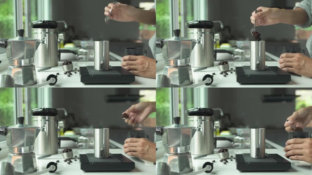 人们用手在不锈钢勺子上的粉状咖啡将烘焙过的咖啡倒入厨房家庭中数字秤冲泡意大利摩卡咖啡壶的杯子中。准备