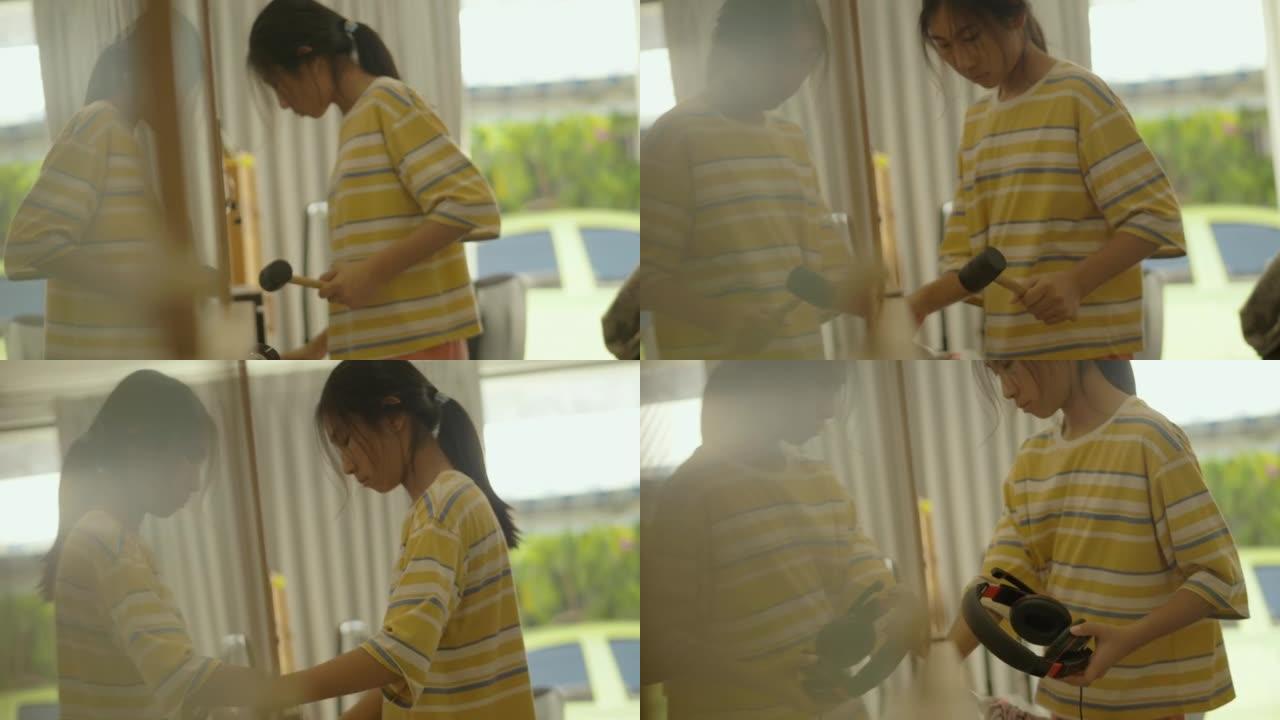亚洲女孩整理她的桌子之前，在家里擦窗户，家务生活方式的概念。