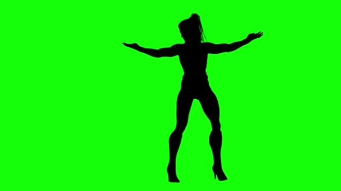 女孩剪影在绿色屏幕上表演超能力移动