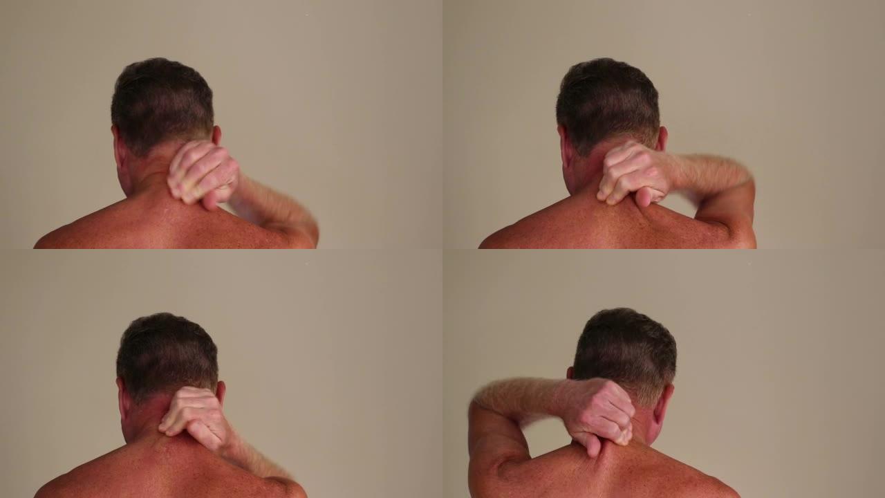 成年男性用手按摩后颈的后视图