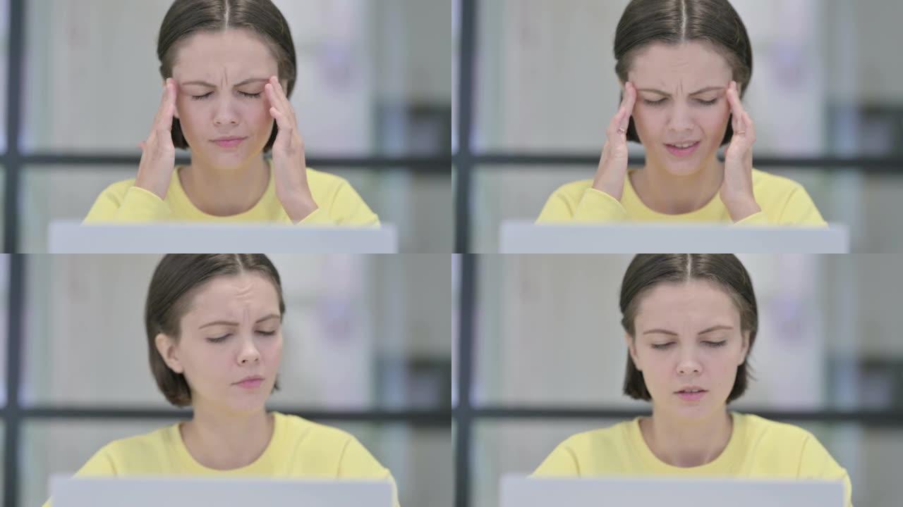 使用笔记本电脑时头痛的女人的特写镜头