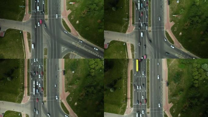 大城市高速公路的十字路口。从上面拍的。汽车的流量在红绿灯处开始移动。航拍。