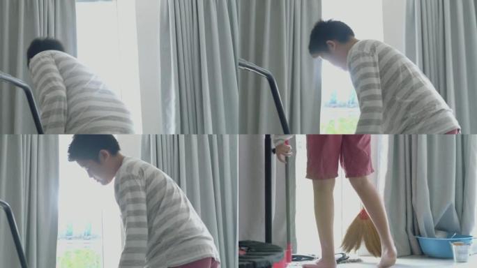 亚洲男孩在家靠近窗户打扫房间，周末生活方式概念。