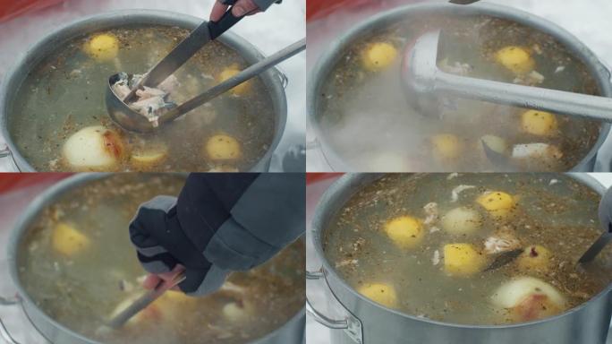 在火上煮鱼汤。