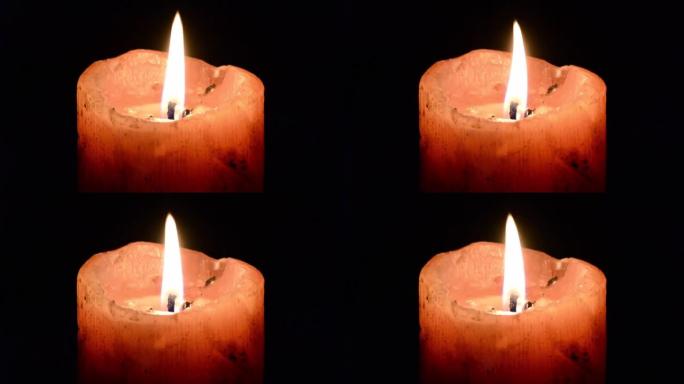 一根在黑暗中燃烧的粗蜡烛。